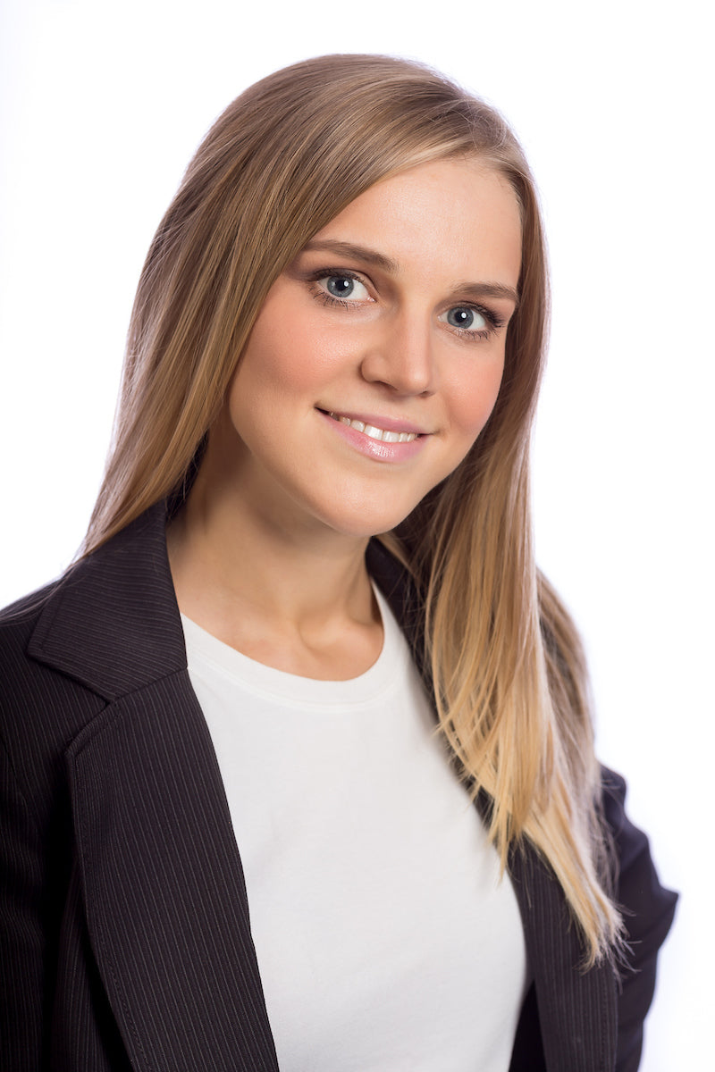 Professional corporate headshot of a woman in a black blazer taken at a NYC photography studio by David DuPuy Studios